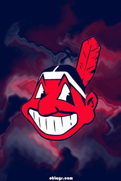 the cleveland indians logo on a red and blue pillow cover with an arrow in it