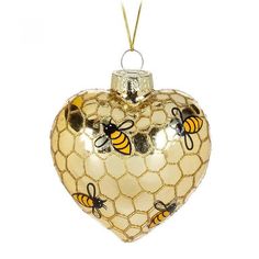 a heart shaped ornament with bees on it