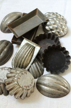 an assortment of metal objects sitting on top of a table