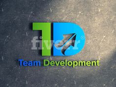 the logo for team development is displayed on a concrete surface with an arrow pointing up