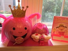 a pumpkin with a crown and other decorations