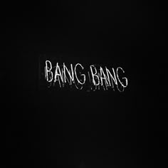 the word bang bang is lit up in the dark