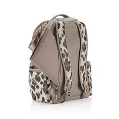 a leopard print backpack is shown on a white background, with the bottom compartment open