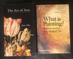 two books sitting on top of a table next to each other, one is titled what is painting?