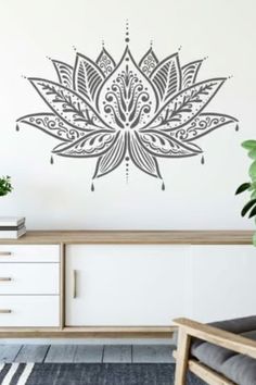 a wall decal with a flower design on it's side, in the middle of a living room