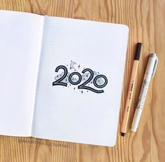 a notebook with the numbers 2020 written on it