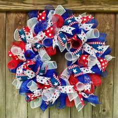 a patriotic wreath with red, white and blue mesh