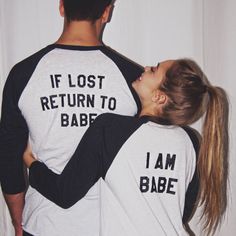 two people wearing matching shirts that say if lost return to babe, i am babe