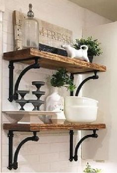 some shelves with pots and vases on them