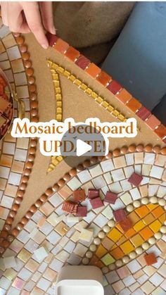 the mosaic bed board is made from old tiles and has been used as a toilet