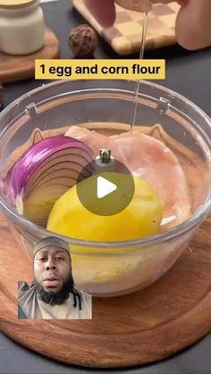 a bowl filled with food on top of a wooden cutting board