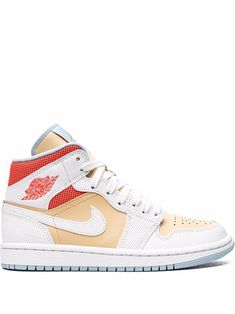 the air jordan 1 retro high top sneaker in white and gold with red accents