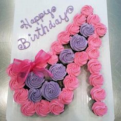 a happy birthday card with cupcakes in the shape of a heart and ribbon