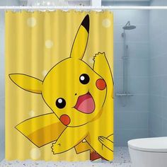 a yellow shower curtain with a cartoon pikachu on it