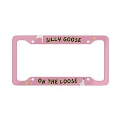 a pink license plate frame that says silly goose on the loose side with cats and stars