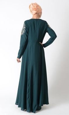 Featuring a traditional modest wear abaya dress in polyester moss crepe fabric adorned with floral thread, dabka and zardozi applique work on the front bodice and sleeves. It is slightly fitted around the waist for fit and flared look to an ensemble along with pleated panels all over the flared bottom skirt.FIT : Relaxed fit.COMPOSITION : Polyester moss crepe.CARE : Dry clean only. Matching Abaya color plain hijab 20" x 70" included Eid Maxi Dress With Intricate Embroidery, Long Dress With Dabka For Eid, Wedding Abaya For Eid In Maxi Length, Long Dabka Dress For Eid, Modest Long Abaya For Fall, Eid Wedding Maxi Length Abaya, Elegant Long Sleeve Maxi Dress With Resham Embroidery, Festive Maxi Length Abaya With Dabka, Traditional Long Dress Abaya For Eid