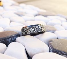 a ring sitting on top of some rocks