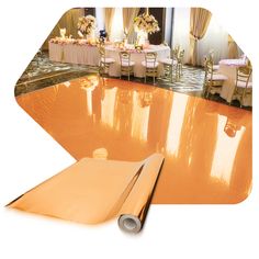 an image of a table setting with gold foil on the floor and white linens