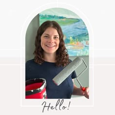 a woman is holding a paint roller and smiling at the camera with her name on it