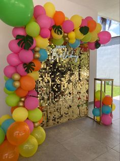 an entrance decorated with balloons and confetti