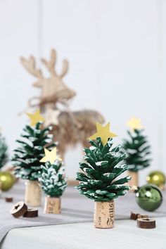 small christmas trees with gold stars on them