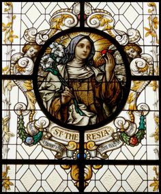 a stained glass window with the image of st teresa