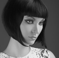 Jet black with short bangs that are cut straight across make this bob a vintage beauty with influence from the 1920's and 1930's.    The inverted concept is showing the back shorter than the front with the ends in front being brushed forward into a point at the chin. This is a very straight style that is cut at jaw length.  More on Vintage Style Bob 1920 Hairstyles, 1920s Hairstyles, Man Hairstyle, A Bob, Short Straight Hair, Funky Hairstyles, Short Black Hairstyles