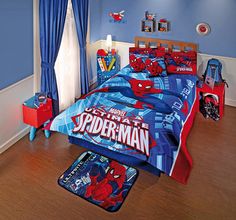 a bedroom with blue walls and spiderman bedding