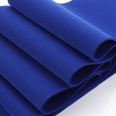 blue fabric rolled up on top of each other