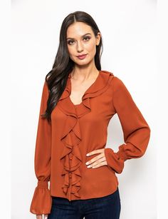 Earn up some serious style points while wearing this Urban Edge Ruffled Blouse on your next day out. Decorated with ruffle trim detailing that traces all the way from the neckline to the hem, this stylish blouse features a V-neckline and long sleeves with elasticated ruffle cuffs. It has a button fastening for closure on the front. *Polyester *Machine wash recommended *Front button fastening for closure *Ruffle trim detailing buttoned cuffs Fall V-neck Top With Ruffle Hem, Fall V-neck Ruffled Tops, Chic Fall Blouse With Ruffle Hem, Fall Workwear Blouse With Ruffle Hem, Fall Office Blouse With Ruffled Collar, Fall Workwear Blouse With Ruffled Collar, V-neck Ruffled Blouse For Work, V-neck Ruffles Blouse For Work, V-neck Ruffle Blouse For Work