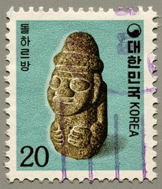 a stamp with an image of a stone statue on it's front and the words,