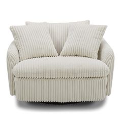 a white corded couch with two pillows on it's back and one arm