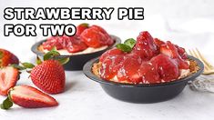 two small pies with strawberries on top and the words strawberry pie for two