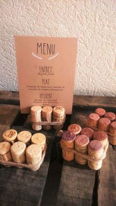 several wine corks are on display in front of a menu