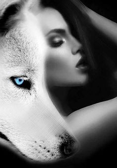 a woman with blue eyes is next to a white wolf