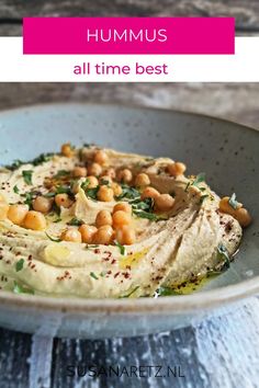 hummus with chickpeas and herbs in a bowl