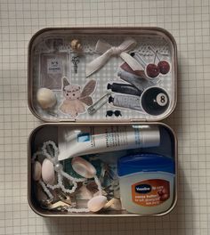 two tins filled with different types of items