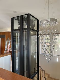 a chandelier hanging from the ceiling in a room