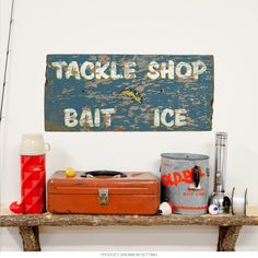 there is a sign that says tackle shop, bat ice and other things on the shelf