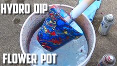 a bucket filled with water and a plastic tube sticking out of it's top