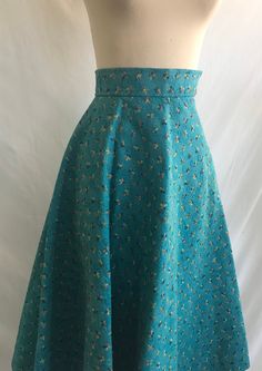 1950's wool felt skirt in a half circle complete with multi colored floral embroidery all over it! Fabric was embroidered first and then cut in a half circle so it only has one seam! Skirt features a high waisted fit with a metal zipper opening at the side and hook and thread loop closures at the waistband. Main color is a nice deep aqua color with salmon pink, yellow, royal blue and moss green stitching.  Skirt is in excellent condition!  No label: appears to have been lovingly handmade!  Measu Felt Skirt, Half Circle Skirt, Rockabilly Skirt, Embroidered Wool, Half Circle, Aqua Color, Salmon Pink, Circle Skirt, Metal Zipper