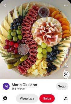 a plate filled with different types of food on top of a white tablecloth next to an iphone screen