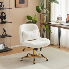 a white office chair sitting in front of a desk with a laptop computer on it