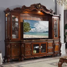 an entertainment center with a large screen tv on it's side and wooden furniture