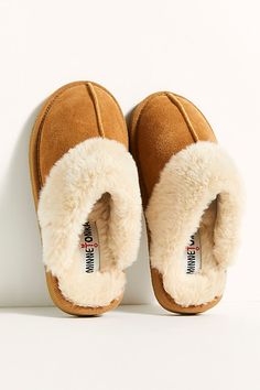 So comfy slippers featured in a soft suede design with a plush lining and a backless slip-on design.* Center seam detail* Cushioned footbed* Treaded outsole Minnetonka Slippers, Brown Slippers, Comfy Slippers, Cute Slippers, Slide Slippers, Winter Slippers, Tan Boots, Slippers Cozy, Platform Slippers