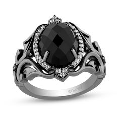 Dare to be different with this spellbinding onyx and diamond ring from the Enchanted Disney Villains Collection inspired by Maleficent. Sterling silver with black rhodium plate The 12.0 x 9.0mm oval-shaped rich black onyx glistens in a halo of diamonds with crown-like details The ornate shank features sculpted scrolling ribbons and black diamonds 1/5 ct. t.w. of diamonds Available in size 7 only ©Disney Unique Engagement Rings Black, Engagement Ring Necklace, Goth Ring, Enchanted Jewelry, Disney Fine Jewelry, Enchanted Disney Fine Jewelry, Frame Ring, Black Engagement Ring, Black Wedding Rings