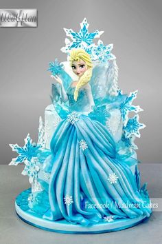 a frozen princess cake with snowflakes on it