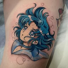 a woman with blue hair and tattoos on her thigh is shown in this tattoo design