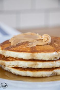 stack of pancakes with peanut butter on top