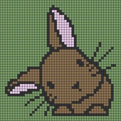 a cross stitch pattern with a dog's head in the center, on a green background